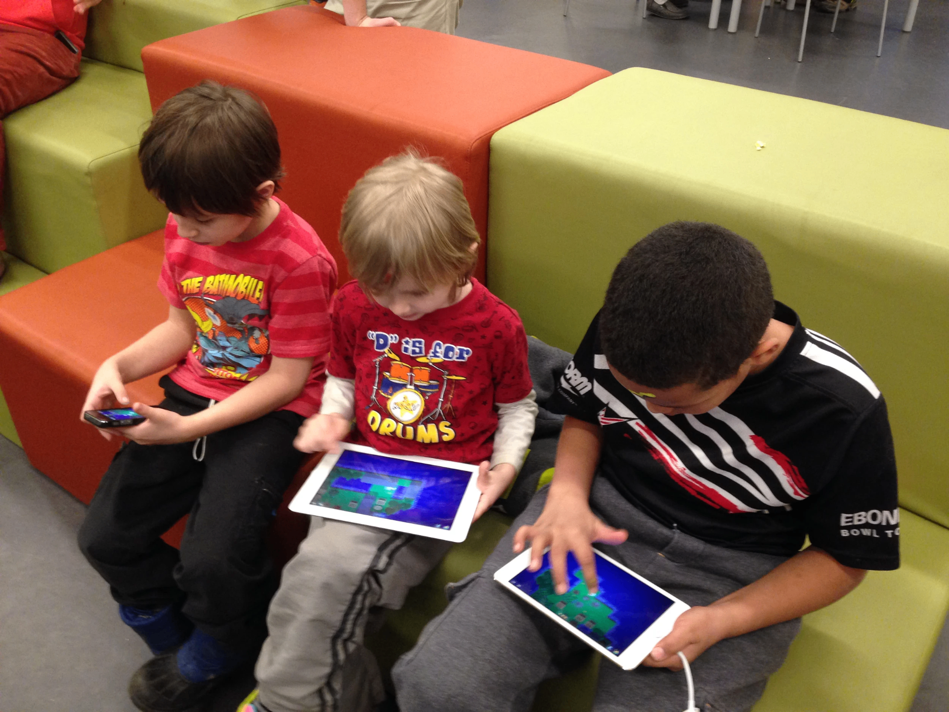 Kids playing King Rabbit on iPads during a usability test